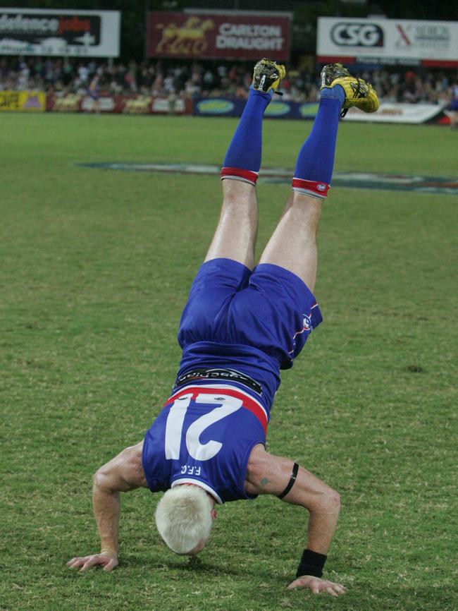 Jason Akermanis brings back his trademark handstand for a one-off performance for the Western Bulldogs. Picture Sam Wundke