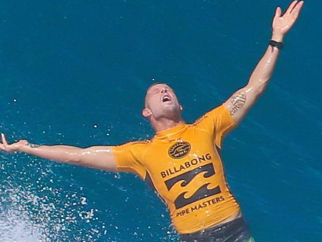 Mick Fanning looks to the heavens after exiting a tube at Pipe.