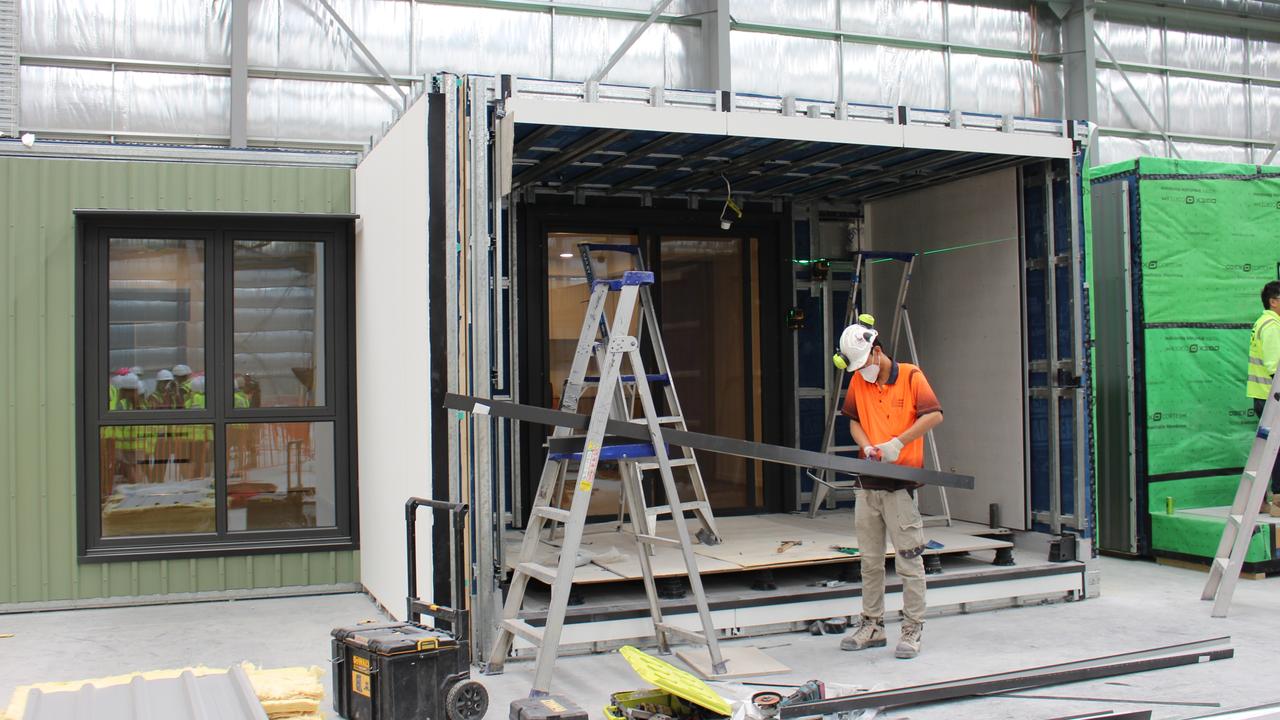 Building team members working on houses inside the prefabricated homes factory. Image: supplied.