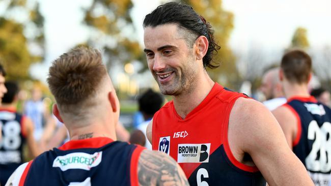 Brodie Grundy chats with Harmes after winning a VFL match. Picture: Getty Images