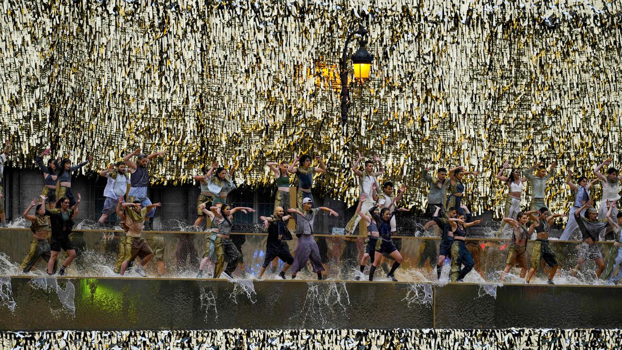 Dancers on the side of the Seine in an Opening Ceremony. Picture: Petros Giannakouris