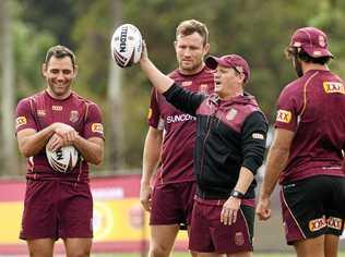 HAVING A BALL: Maroons coach Kevin Walters shares a light hearted moment with (from left) Cameron Smith, Gavin Cooper and Johnathan Thurston during Queensland camp ahead of Game Two last month. Picture: Contributed