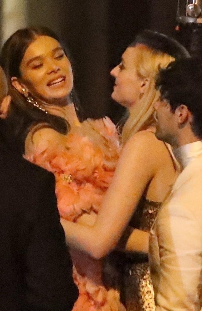 Hailee Steinfeld and Sophie Turner hug it out at Jay-Z and Beyonce’s Oscar party held at Chateau Marmont. Picture: BackGrid 