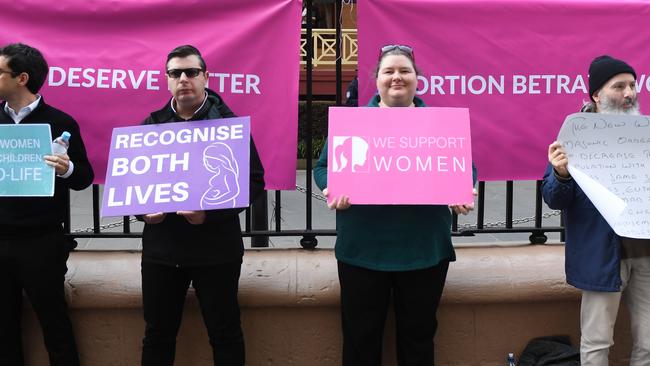 A small group of anti-abortion protesters rally outside NSW state parliament. Picture: AAP