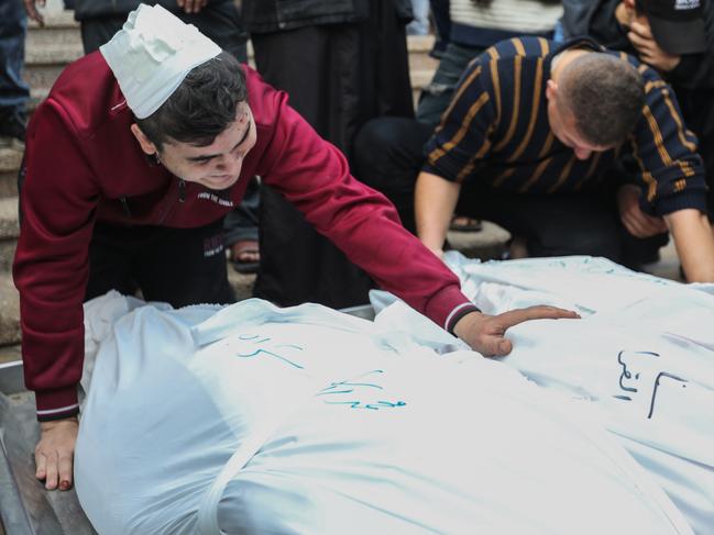 People mourn as they collect the bodies of Palestinians killed in an air strike in Khan Yunis, Gaza. Picture: Getty Images