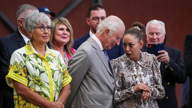 Britain’€™s King Charles III (C) listens to Jody Broun (L), CEO National Indigenous Australians Agency, while watching a traditional performance during a visit to the National Centre of Indigenous Excellence. Picture: Lisa Maree Williams / POOL / AFP