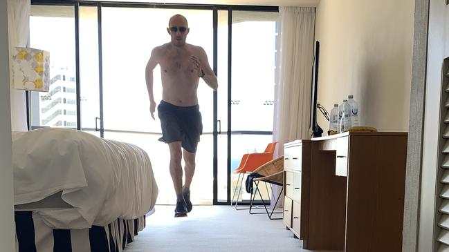 Dimitri Zafiriadis did the Manchester Marathon while in his room in quarantine at QT Hotel on the Gold Coast, just because he can. Picture: Supplied.