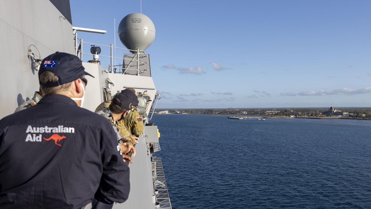 HMAS Adelaide sails into the port of Nuku'alofa.