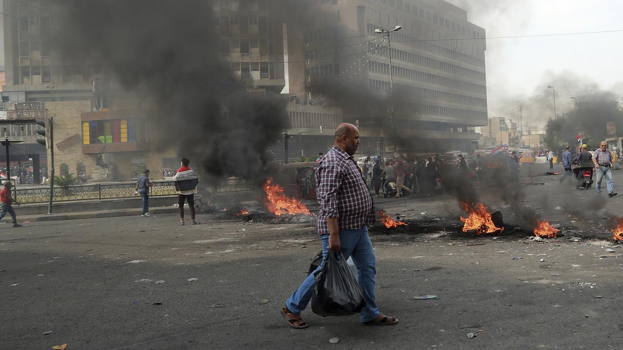 Fires set by protesters close roads during ongoing anti-government protests near Khilani Mosque in Baghdad, Iraq. Picture: AP Photo/Hadi Mizban