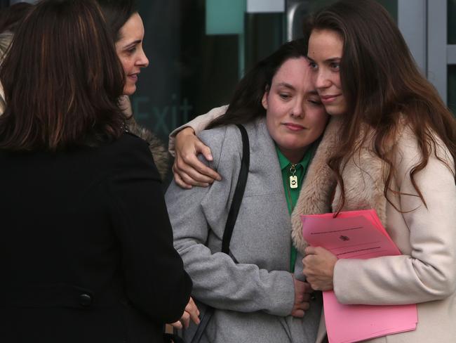 People react as they leave the coroner's court in Warrington following the conclusion of the inquest. Picture: AFP / Geoff Caddick