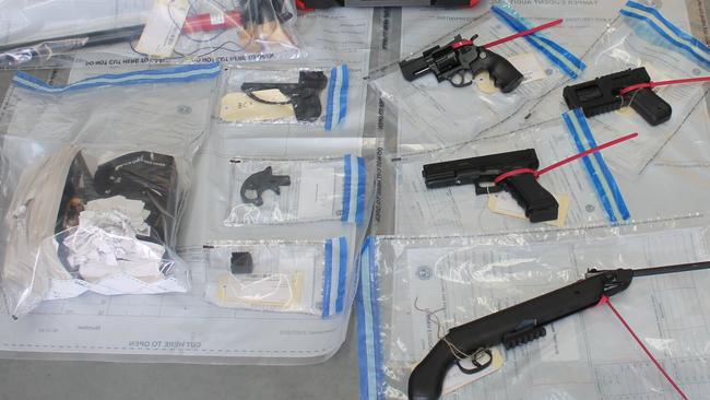 Firearms and 3D-printed parts were found in the raid. Picture: SA Police