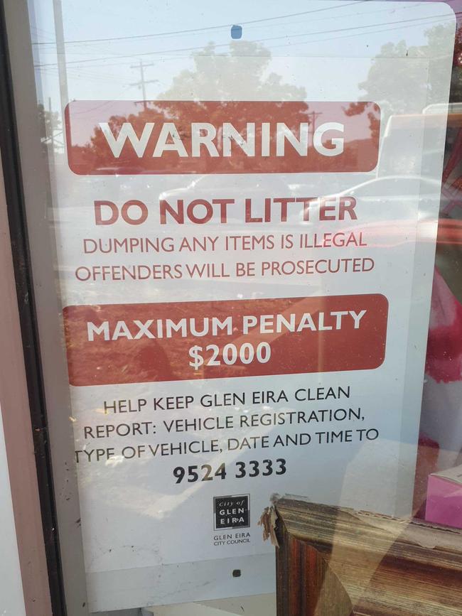 A Glen Eira Council litter warning sign displayed in the Salvation Army East Bentleigh store window. Photo: Glen Eira Council media