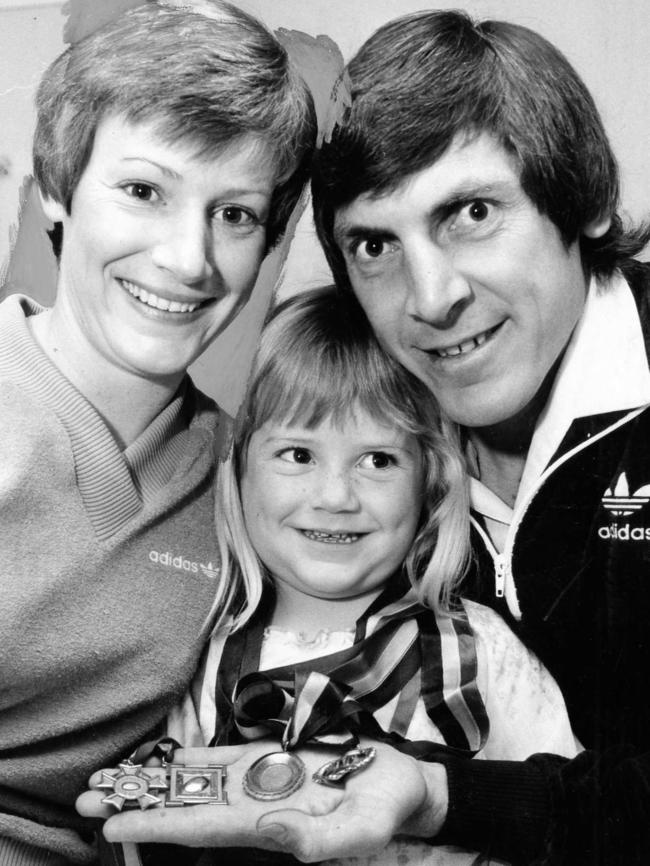 Port Adelaide’s Russell Ebert with wife Dian and daughter Tammie, 4, holding his four Magarey Medals, in 1980.