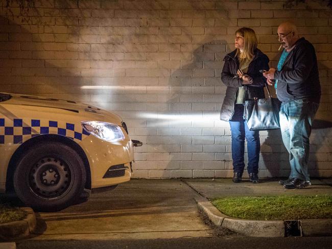 People arrive at the scene to speak with police. Picture: Jake Nowakowski