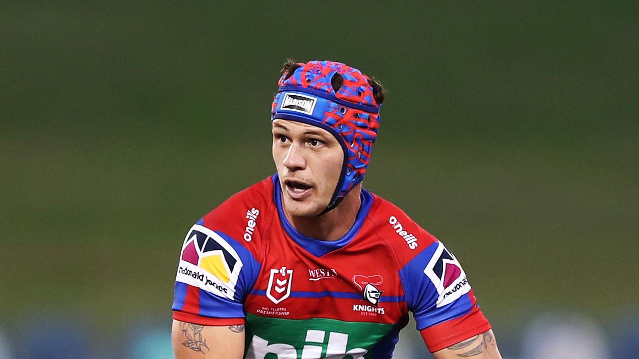 Kalyn Ponga of the Knights runs the ball against the Raiders