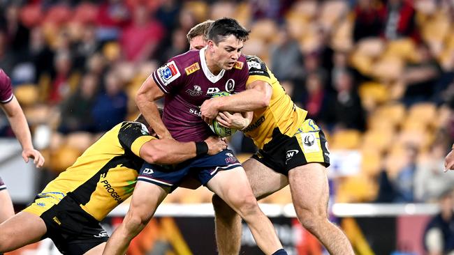 BRISBANE, AUSTRALIA - JULY 17: Jock Campbell of the Reds is tackled during the round three Super Rugby AU match between the Reds and Force at Suncorp Stadium on July 17, 2020 in Brisbane, Australia. (Photo by Bradley Kanaris/Getty Images)