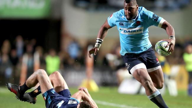 Waratahs winger Taqele Naiyaravoro steamrolls a Blues opponent.   Picture: AAP