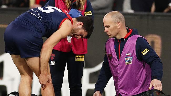 MELBOURNE . 02/09/2022. AFL. 2nd Qualifying Final. Melbourne vs Sydney Swans at the MCG. Christian Petracca of the Demons with the physio at qtr time . Picture by Michael Klein