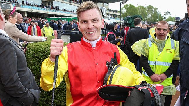 Jockey Ben Melham returns to scale after his winning ride on Grand Marshal. Picture: Ian Currie