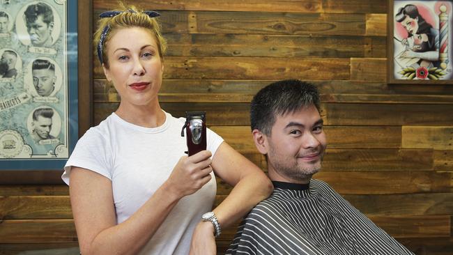 Joy Arnott owner of Star Barber has had a woman lodge an anti-discrimination complaint against her because she only cuts men's hair. Pictured with Carlos Sylianteng Picture: Keri Megelus