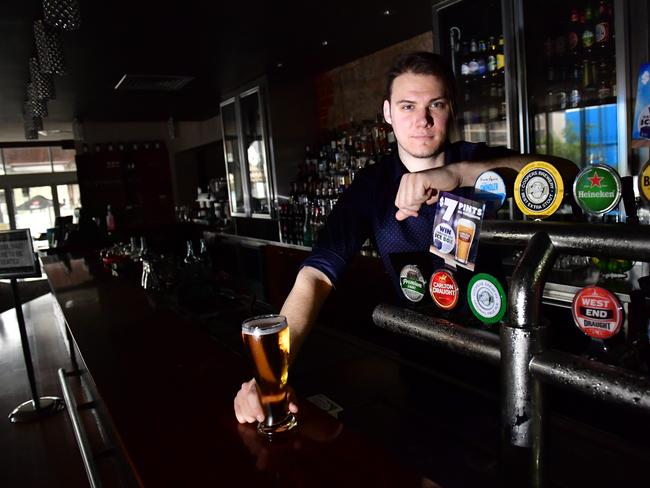 Barman Lachlan Haynes at an empty Torrens Arms Hotel. Picture: Keryn Stevens