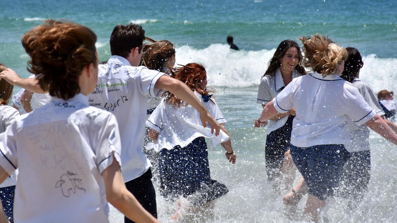 Year 12 graduates from schools across the Sunshine Coast hit to the water at Mooloolaba Beach to celebrate the end of their schooling. Photo: Mark Furler