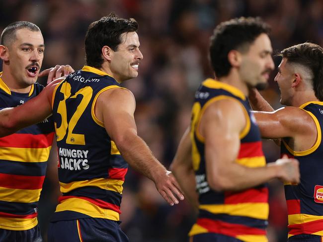 ADELAIDE, AUSTRALIA - MAY 02: dDarcy Fogarty of the Crows celebrates a goal with team mates uring the 2024 AFL Round 08 match between the Adelaide Crows and the Port Adelaide Power at Adelaide Oval on May 02, 2024 in Adelaide, Australia. (Photo by Sarah Reed/AFL Photos via Getty Images)