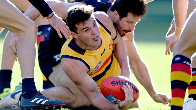 Brad Crouch wins the ball in a pack for the Crows. Picture: Joe Castro (AAP)