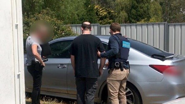 James David Ryan Sharp was arrested by Australian Federal Police at his home.