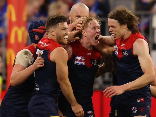 Clayton Oliver of the Demons celebrates with his teammates. Picture: Paul Kane/Getty Images