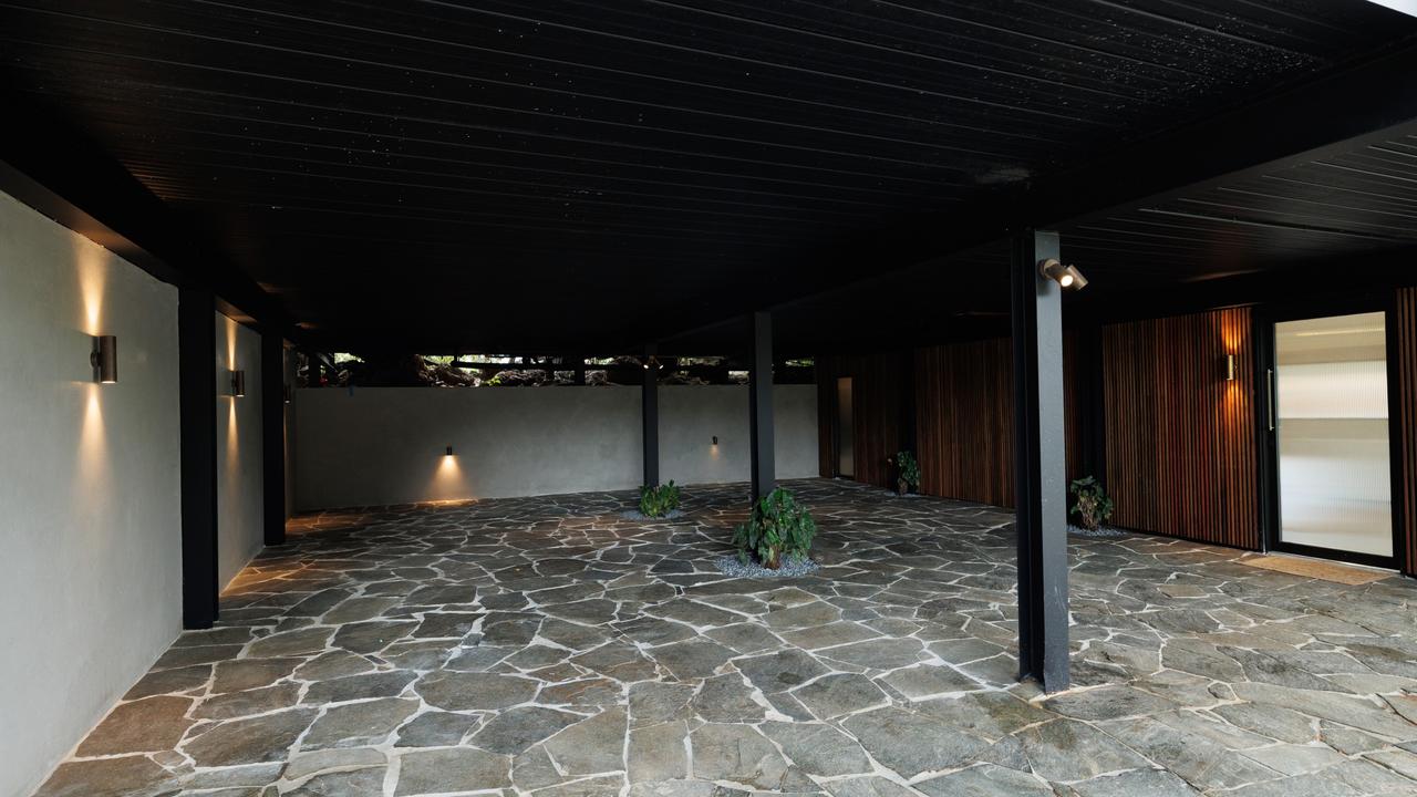 The new carport features crazy paving, timber and pops of greenery. Picture: Supplied