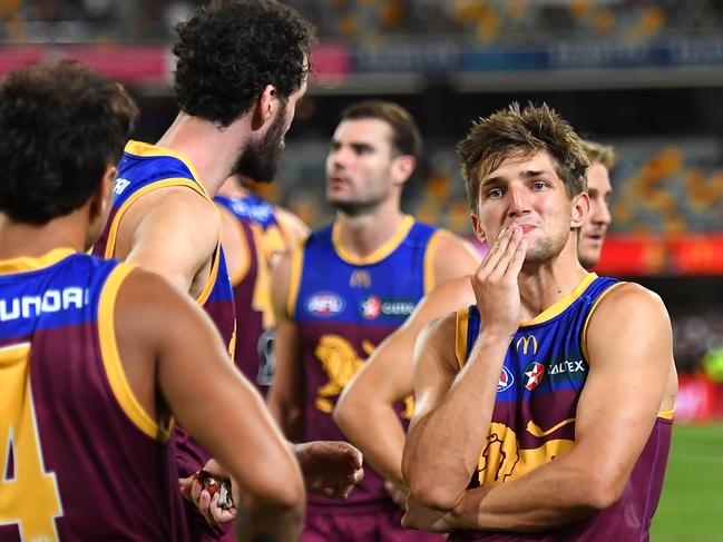 BRISBANE, AUSTRALIA - MARCH 28: Brisbane Lions react after their defeat during the round three AFL match between Brisbane Lions and Collingwood Magpies at The Gabba, on March 28, 2024, in Brisbane, Australia. (Photo by Albert Perez/AFL Photos via Getty Images )