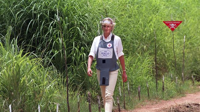 Princess Diana, wearing a bombproof visor, visits a mine field in Huambo, in Angola on January 15, 1997 Picture: AP