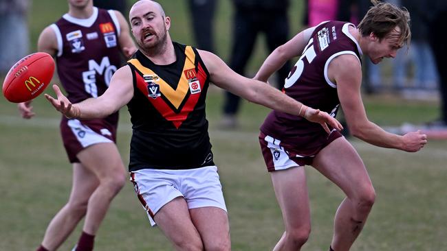 BFL: Bacchus Marsh’s Jason Robinson juggles the mark. Picture: Andy Brownbill