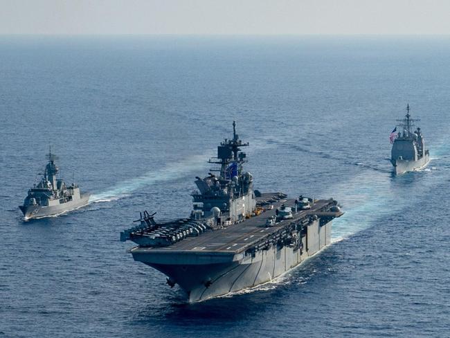 (L-R) Royal Australian Navy helicopter frigate HMAS Parramatta conducts officer of the watch manoeuvres with amphibious assault ship USS America, guided-missile cruiser USS Bunker Hill and guided-missile destroyer USS Barry in the South China Sea. *** Local Caption *** Royal Australian Navy Anzac class frigate HMAS Parramatta and her crew of 190 officers and sailors departed Fleet Base East in February for a deployment to South East Asia.  The deployment is a valuable opportunity to build relationships with Australia's regional partners and demonstrate the professionalism and capability of Navy and its people. Picture: Department of Defence