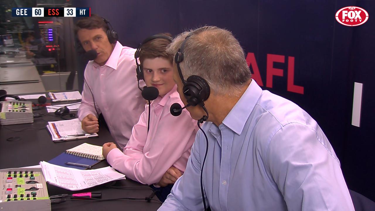 High-schooler Fletcher Fraser, the winner of Fox Footy's 'So You Think You Can Commentate?' competition, with Paul Roos and Dwayne Russell during the Geelong v Essendon JLT Community Series game.