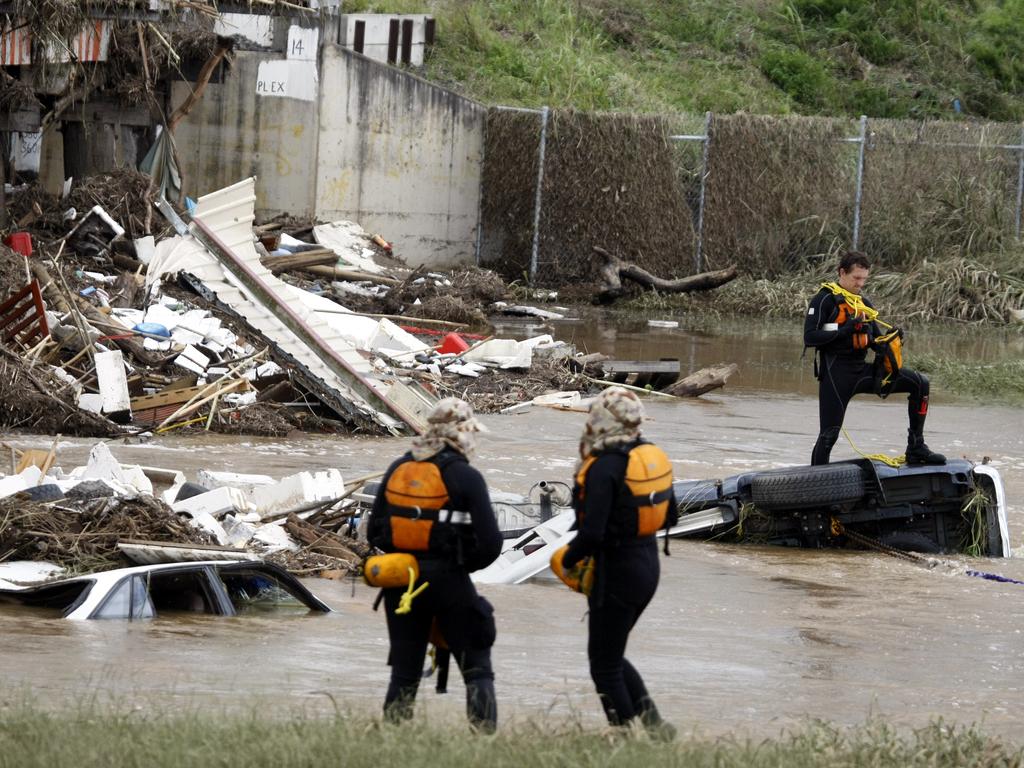 Disaster victim identification police scour the debris at Grantham.