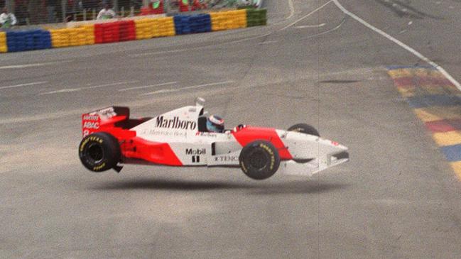 Finnish driver Mika Hakkinen flies through the air moments before crashing into a tyre wall during the 1995 Australian Grand Prix in Adelaide.