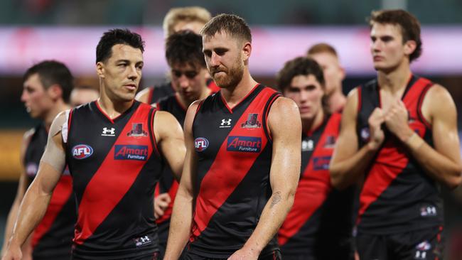 Dylan Shiel and Dyson Heppell after Saturday night’s loss. Picture: Matt King/AFL Photos/via Getty Images