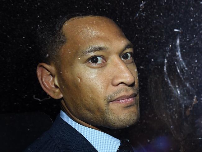 Wallabies star Israel Folau leaves a Code of Conduct hearing in Sydney, Tuesday, May 7, 2019. Folau appeared before a code of conduct hearing to fight Rugby Australia's decision to terminate his contract after he posted in mid-April on social media that gay people, along with other 'sinners' will face damnation unless they repent. (AAP Image/Joel Carrett) NO ARCHIVING