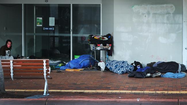 Homeless asleep in the cold empty streets of Southport in the early hours of the morning. A crowd of homeless people asleep in Nerang St shopping precinct, once the CBD of the Gold Coast. . Picture Glenn Hampson