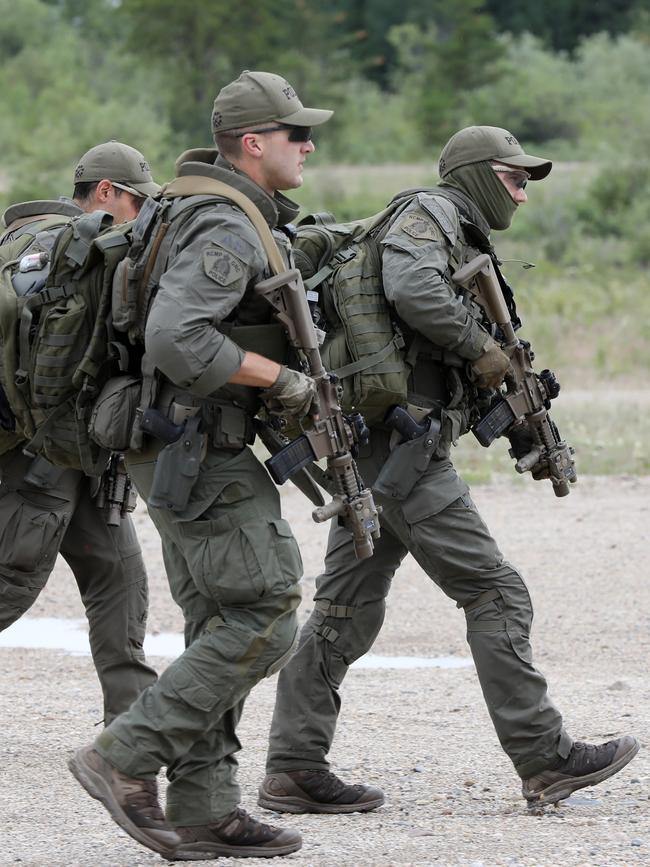 Police, pictured during their hunt for the Canada killers. Picture: News Corp Australia