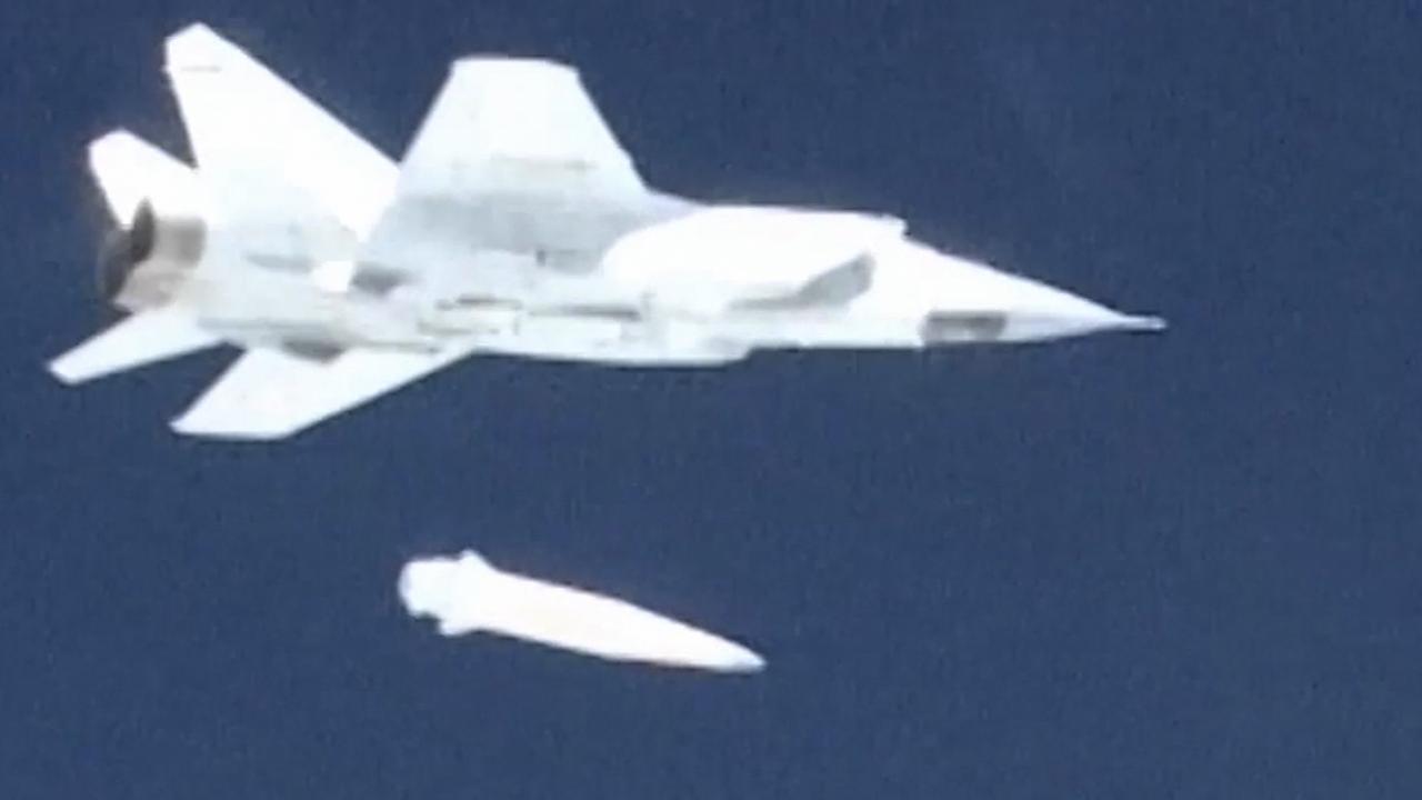 A Russian MiG-31 fighter jet releases the new Kinzhal hypersonic missile during a test at an undisclosed location in Russia. Picture: AP/Russian television