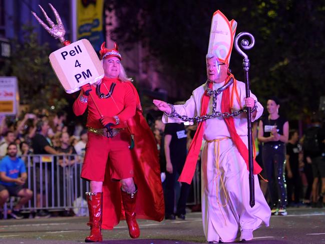 A look-alike Cardinal George Pell marched while chained to the Devil. Picture: Tracey Nearmy