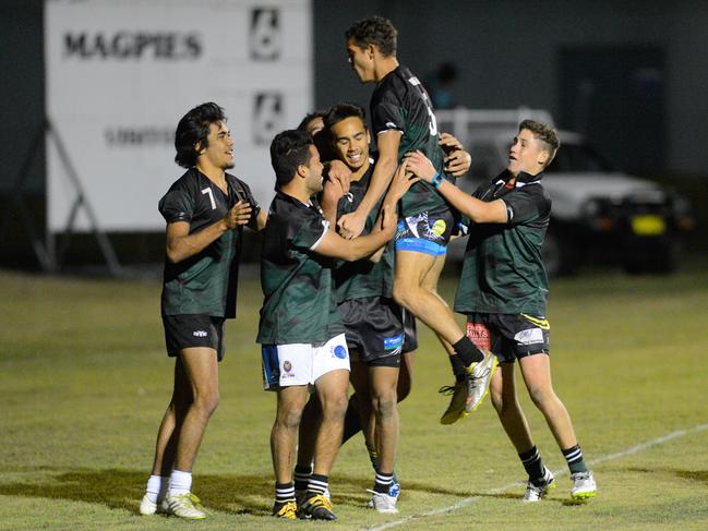 DARE TO DREAM: Maclean High players jump for joy to celebrate Daine Laurie’s second half try against Callaghan College in round of 20 match of the University Shield in 2016.