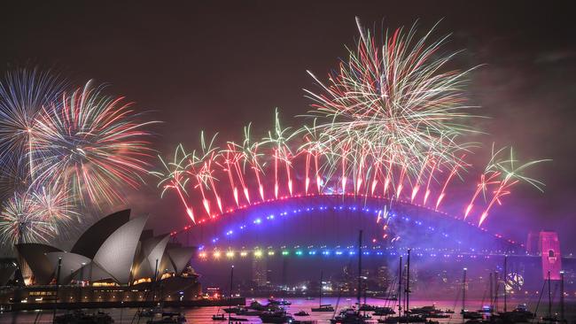 Fireworks explode over the Sydney Harbour Bridge and the Sydney Opera House. Picture: Getty Images.