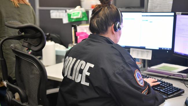 NT Police Joint Emergency Services Communication Centre operators taking in triple-0 calls.