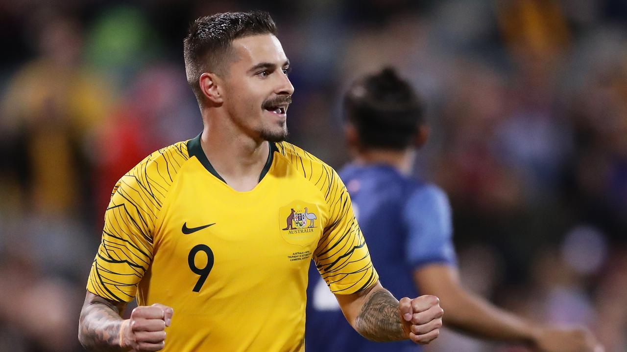 Jamie Maclaren celebrates a goal.