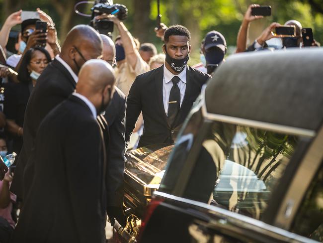 The casket of George Floyd is placed into a hearse at Fountain of Praise church in Houston, Monday, June 8, 2020. Floyd died May 25 after being restrained by police in Minneapolis. (Ricardo B. Brazziell/Austin American-Statesman via AP)