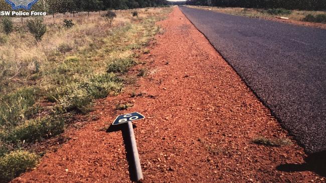 Road signs, poles and rocks were used to build a makeshift airstrip on a road about 40km outside Brewarrina where the stolen plane was supposed to rendezvous with others.